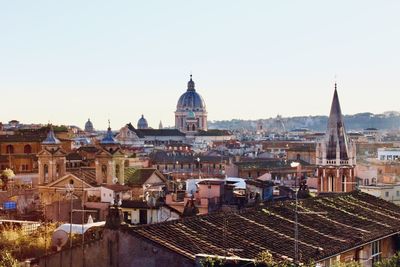 High angle view of buildings in city against clear sky