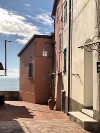 Street amidst buildings against sky