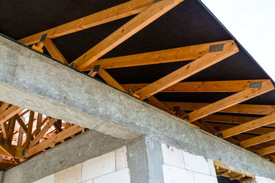 Low angle view of metallic structure against sky