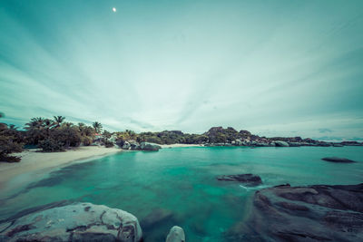 Scenic view of sea against cloudy sky