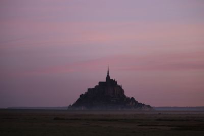 View of temple building against sky during sunset