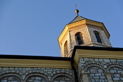 Low angle view of building against blue sky