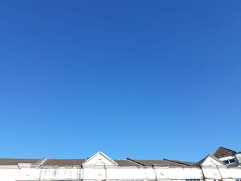 Low angle view of building against blue sky