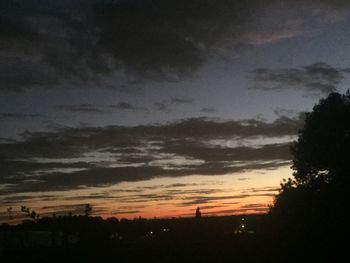 Scenic view of silhouette landscape against sky at sunset