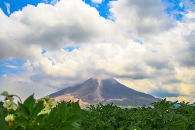 Scenic view of mount sinabung against cloudy sky