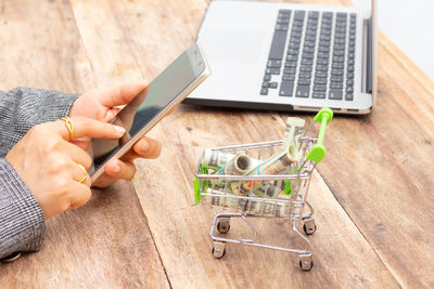 Man using mobile phone on table