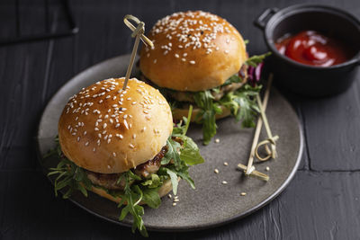 Burgers with chicken cutlet and greens