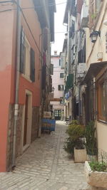 Narrow street along buildings