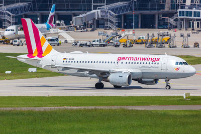 View of airplane at airport runway