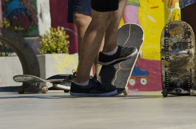 Low section of man skateboarding outdoors