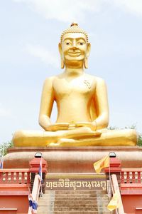 Low angle view of statue against sky