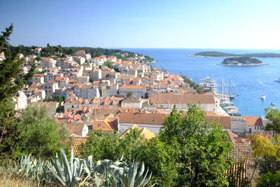 High angle view of townscape by sea