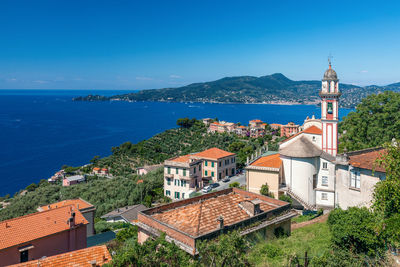 View of chiesa sant'andrea di rovereto at chiavari, portofino area visible on the horizon.