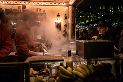 People working on display at night