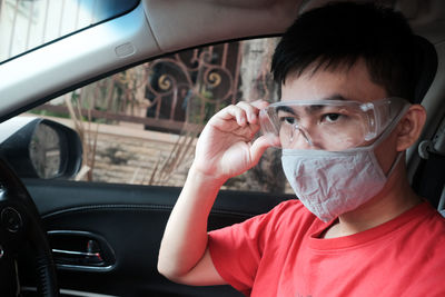 Portrait of man in car