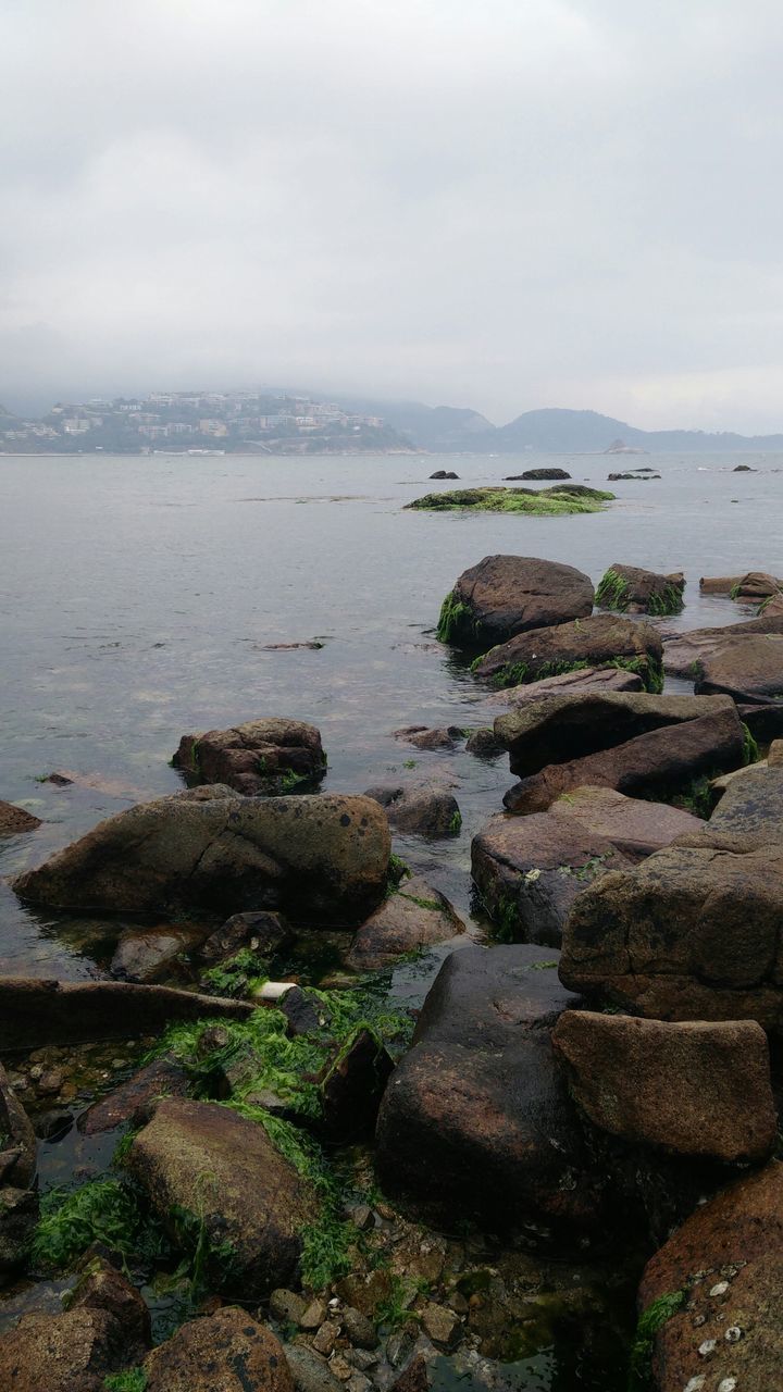 water, sea, sky, rock - object, tranquil scene, tranquility, scenics, horizon over water, beauty in nature, nature, stone - object, cloud - sky, shore, beach, rock, idyllic, coastline, rock formation, day, outdoors