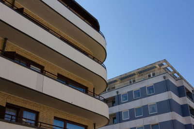 Low angle view of building against clear blue sky