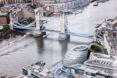 High angle view of tower bridge over thames river in city seen from glass