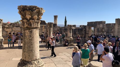 Group of people in front of historical building