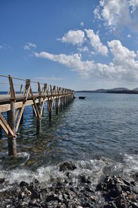 Pier over sea against sky