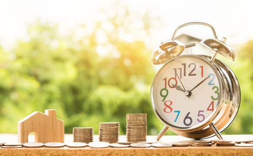 Close-up of clock on wooden table