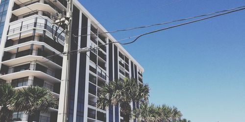 Low angle view of building against blue sky