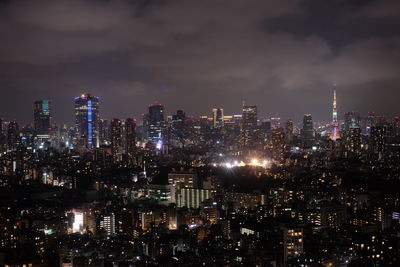 Aerial view of city lit up at night