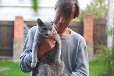 Man holding cat