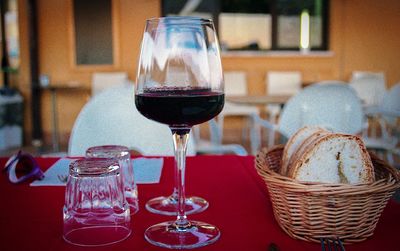 Close-up of wineglass in glass on table