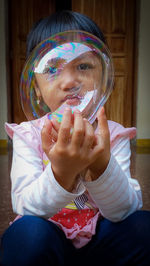 Portrait of woman holding crystal ball