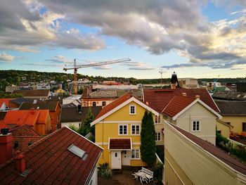 Houses in town against sky