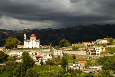 Buildings in city against sky