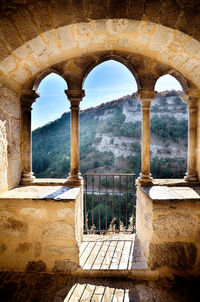 View of historic building seen through window