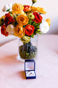 Close-up of roses in vase on table