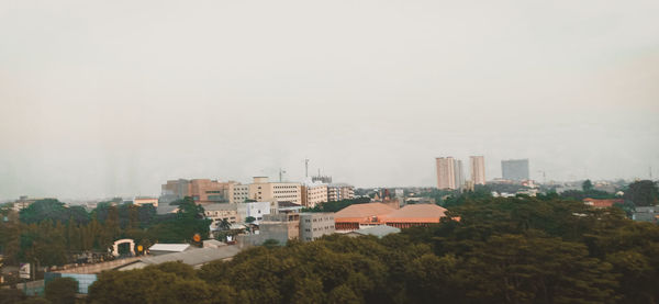 Buildings in city against sky