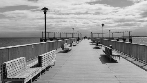 View of pier on sea against sky