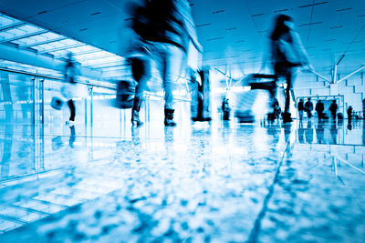 Group of people walking in airport