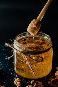 Close-up of chocolate in jar on table