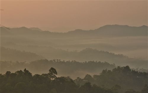 Scenic view of mountains against sky during sunset