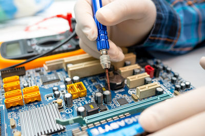 Close-up of person working on mobile phone