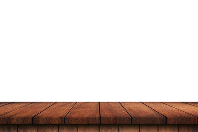 Close-up of hardwood floor against clear sky