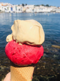 Close-up of ice cream in front of water