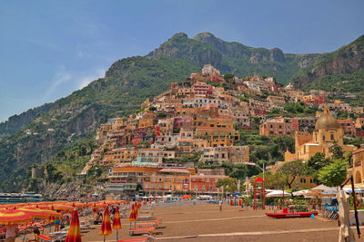 Panoramic view of buildings and mountains against sky