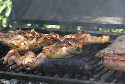 High angle view of meat on barbecue grill