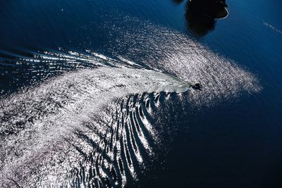 A high contrast shot of a boats wake on lake lanier