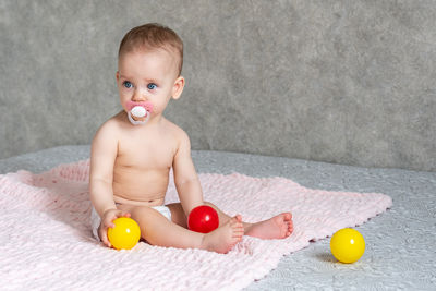 Portrait of cute boy playing with toy