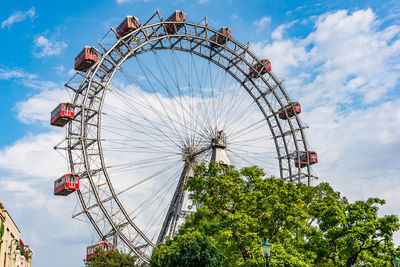 Low angle view of ferris wheel against sky