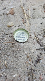 High angle view of text on sand