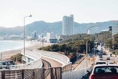 Seaside view of city and beach from car window in japan