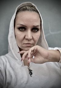 Portrait of beautiful woman holding camera